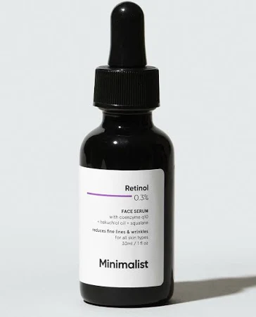 A 30ml dark glass dropper bottle of Minimalist Retinol 0.3% Face Serum. This potent anti-aging formula targets wrinkles and uneven texture.
